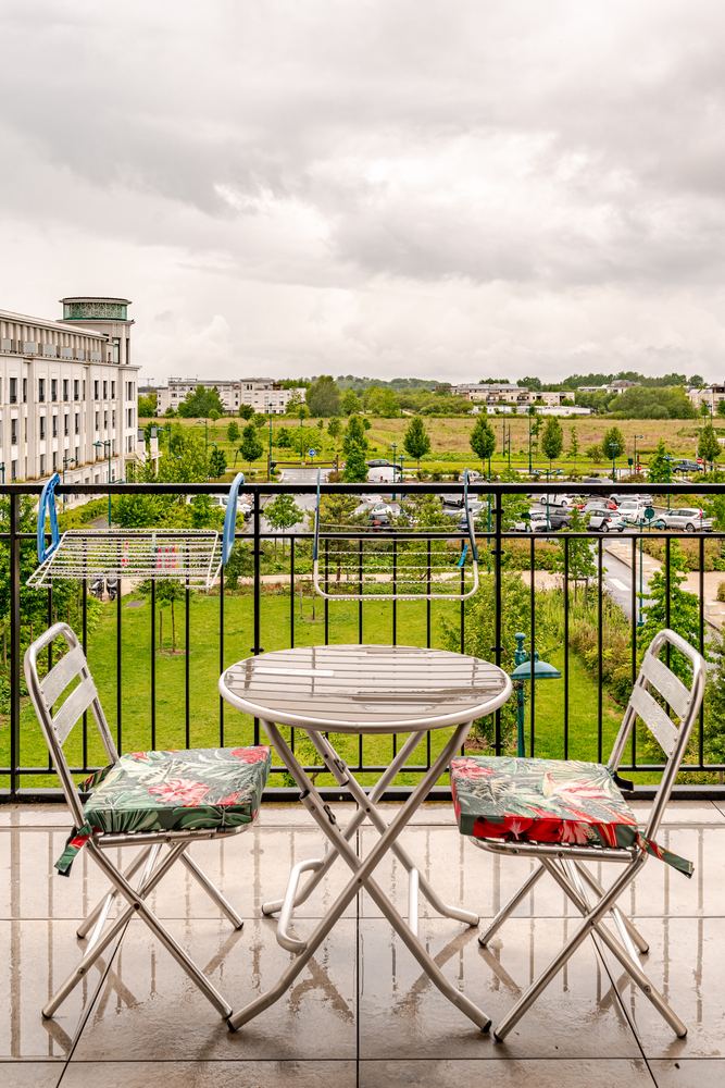 Private terrace with bistro table overlooking the park