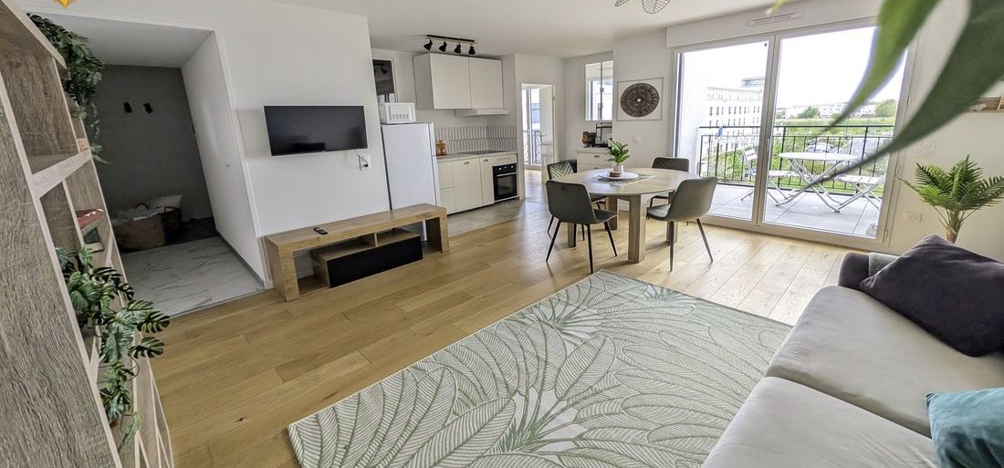 Bright living room at The Lion Suite with balcony view