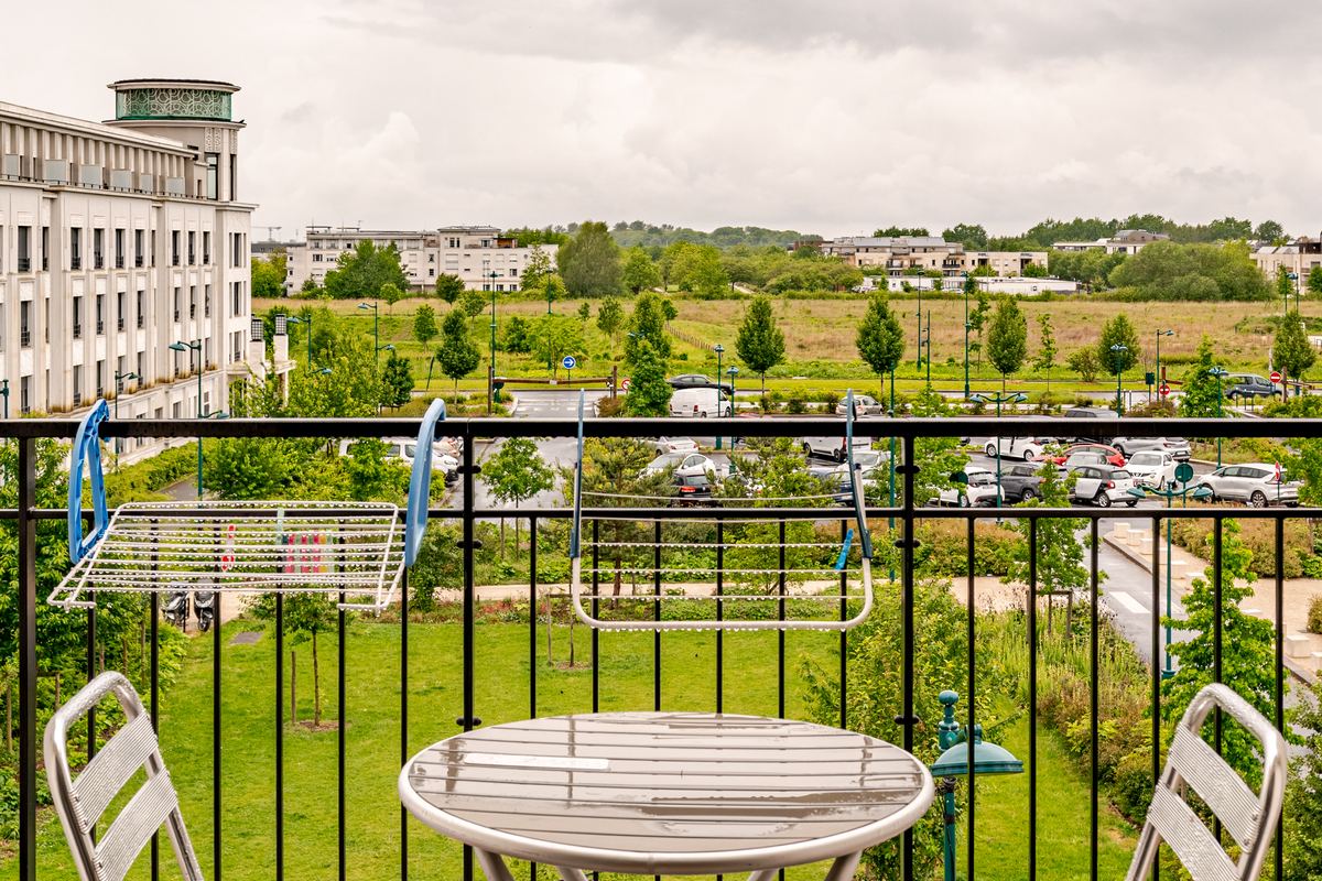 Private terrace with bistro table overlooking the park